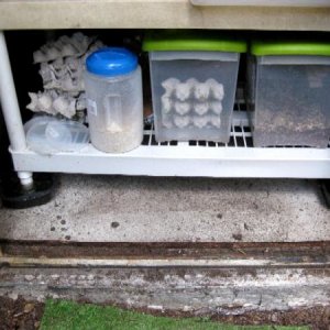 Legs sit in these metal pans to keep out the ants.