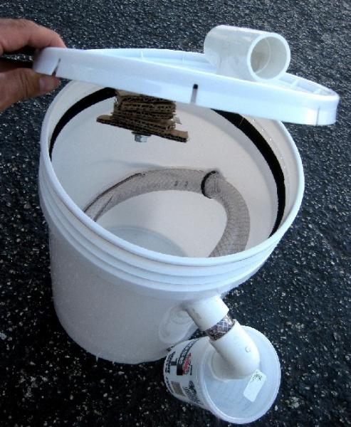 Simple five gallon bucket version, cardboard pieces slid onto a bolt in the lid is where adult flies lay their eggs. Just add a crawl off tube into a